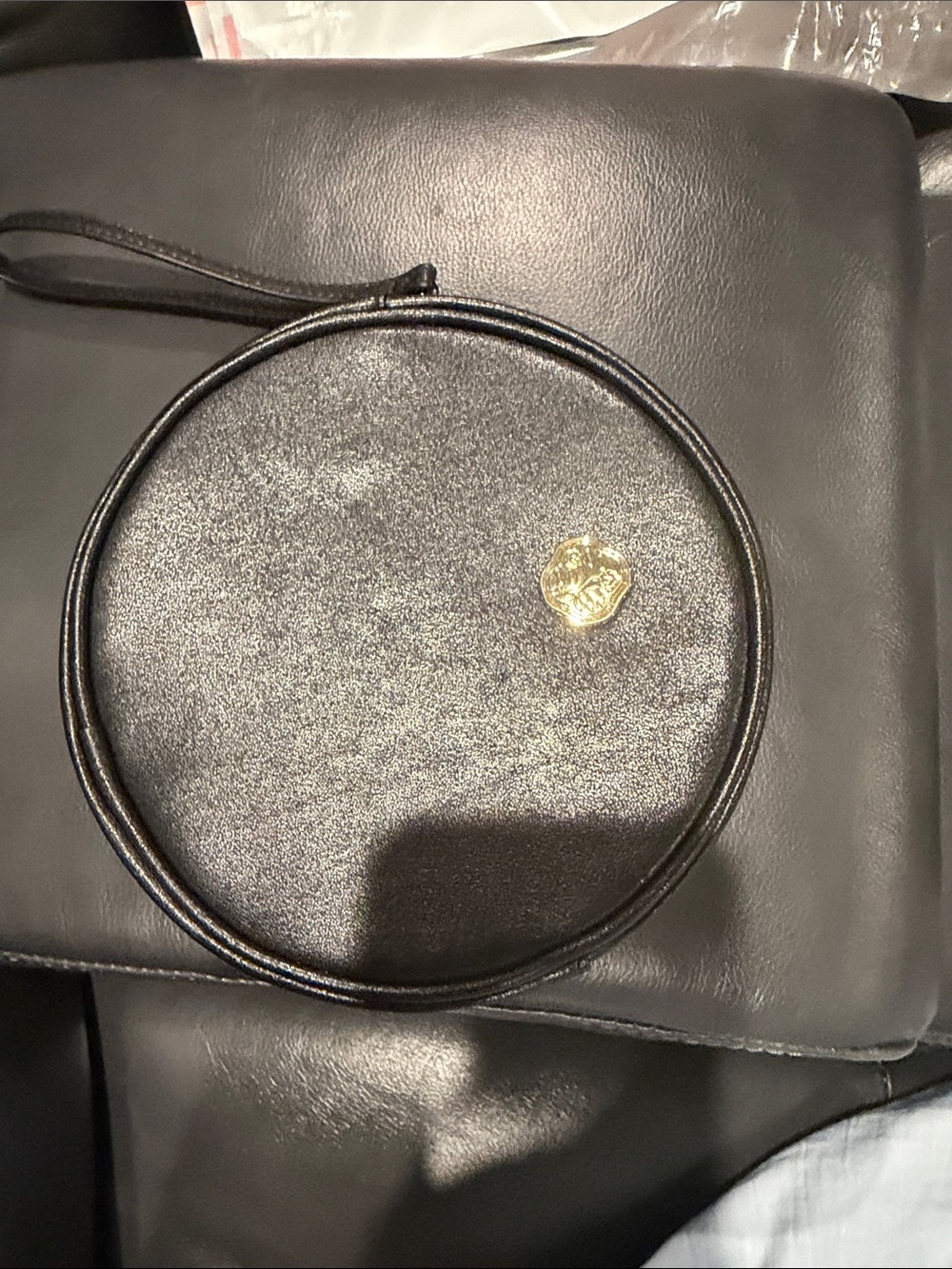 Round Black Wristlet Clutch with Gold Accent